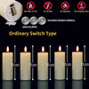 A set of five white LED pillar candles with a remote control and timer displayed against a dark background.