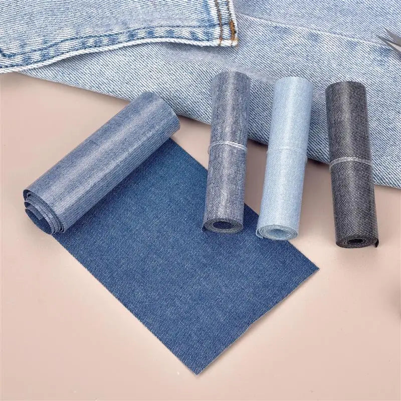Rolls of denim fabric and iron-on patches are displayed on a light background.