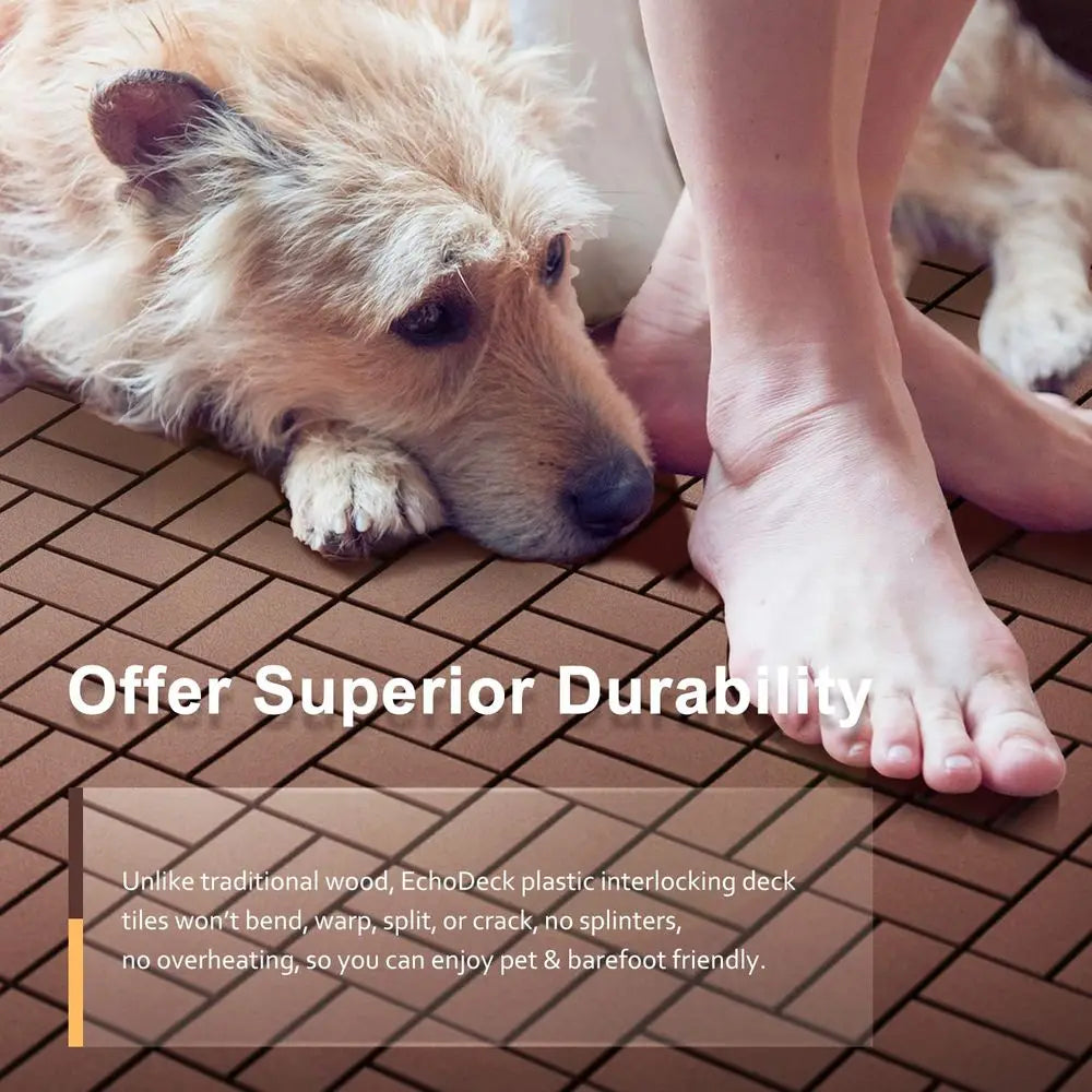 A dog is lying on a brown interlocking deck tile while a person's bare foot is visible nearby.