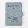 A light gray leather passport holder featuring a world map and an airplane icon.