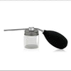 A silver and black refillable spray bottle with a long applicator for precision styling.