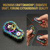 A hand holding a rainbow iridescent sprocket fidget spinner made of zinc alloy.