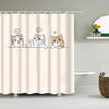A shower curtain featuring cute cartoon cats with speech bubbles and expressions.