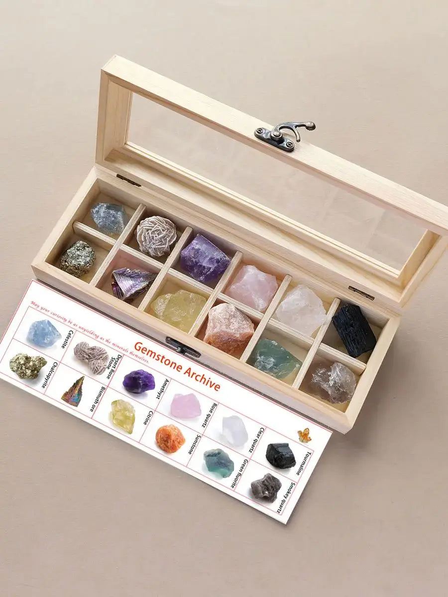 A wooden gift box containing twelve natural gemstone crystals arranged in compartments.