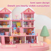 Pink dollhouse featuring a multi-story castle design with clear details and accessories.