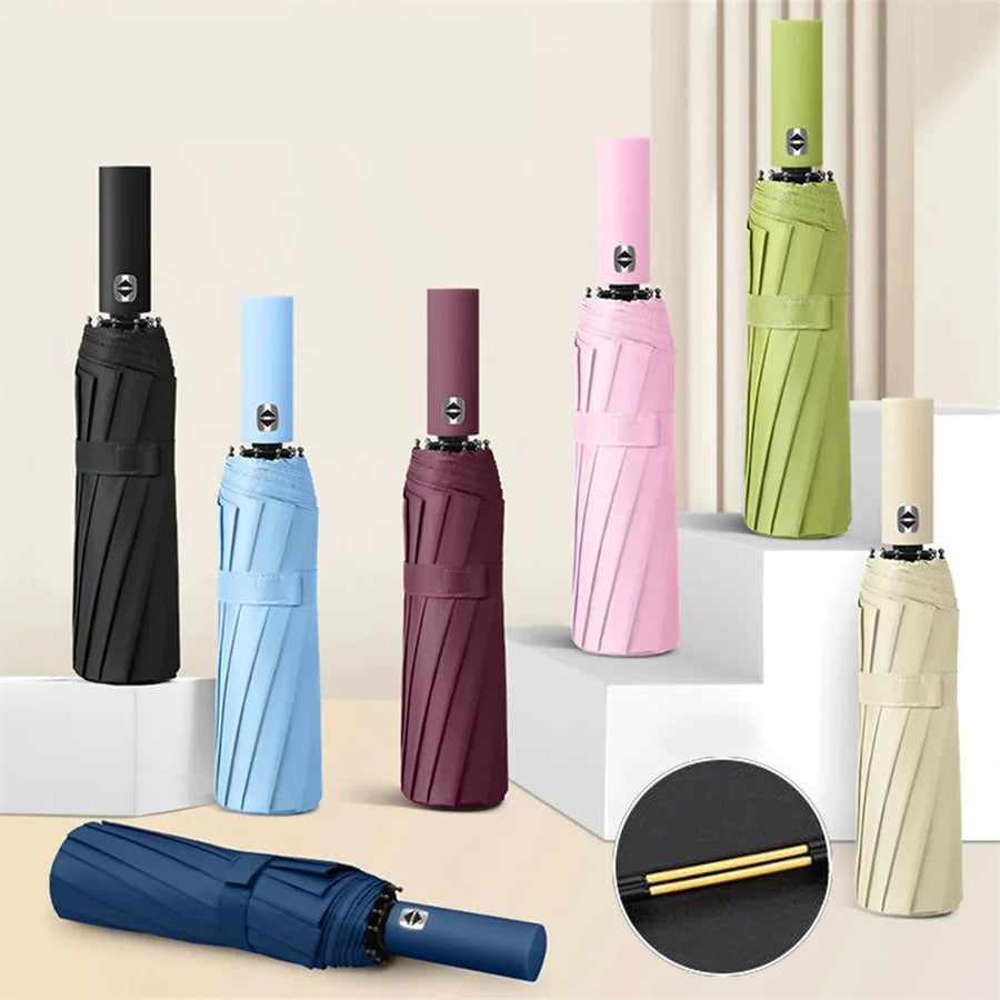A collection of heavy duty automatic folding umbrellas in various colors including black, light blue, pink, purple, and olive