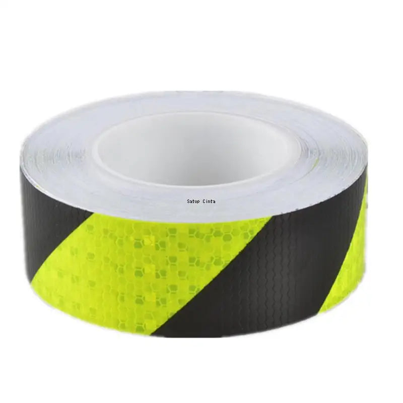 Roll of high-visibility reflective tape with a honeycomb pattern, black and neon yellow.
