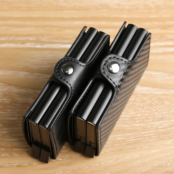 Black slim dual-layer RFID-blocking carbon fiber wallet for men shown on a wooden surface.