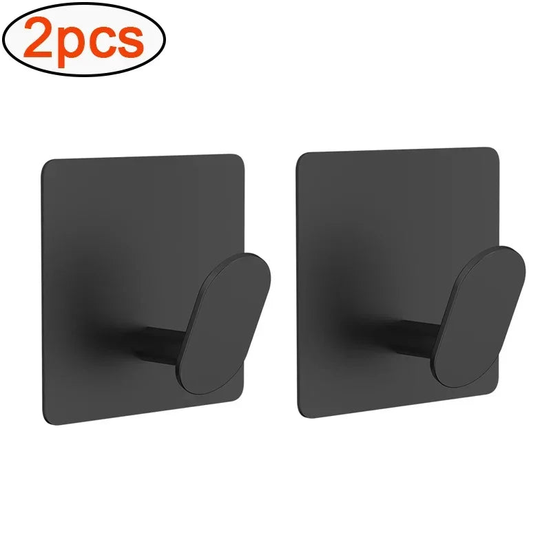 Two black adhesive stainless steel robe hooks for no-drill wall mounting.