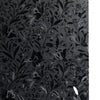 Dark gray floral pattern of elegant tulips and leaves on a window film.