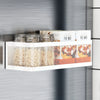 A white magnetic refrigerator storage rack holding glass jars and boxes of pie mix ingredients.