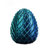 A close-up of a teal blue twisted fidget egg stress relief toy.