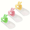 Three plastic rabbit-themed anti-splash faucet extenders in yellow, pink, and green.