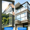 A close-up view of a clear window pane with frosted privacy film being applied to the glass.