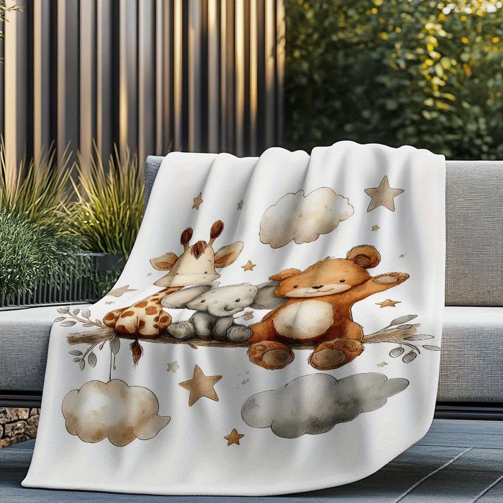 A white blanket featuring watercolor illustrations of a giraffe, elephant, and teddy bear on a neutral background.
