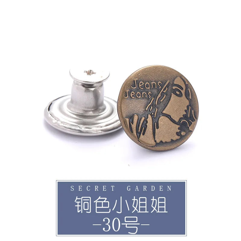 A round brass button with the text Jeans Jeans stamped on it, shown next to a silver button repair kit component.