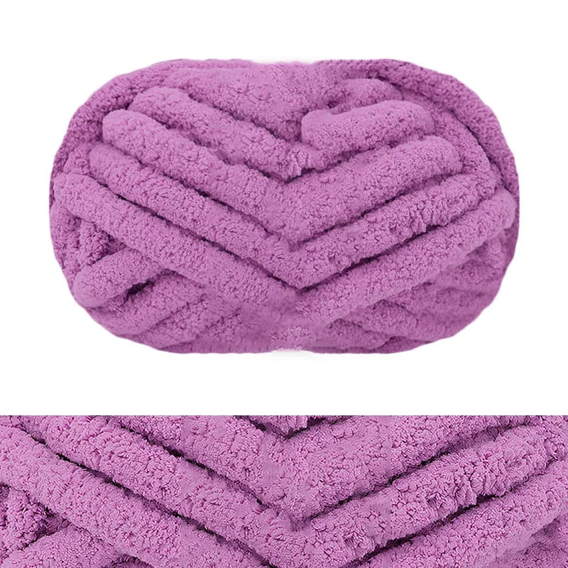 A close-up of a purple chunky chenille yarn with a chevron knit pattern.
