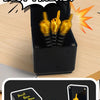 A black box containing three gold middle finger surprise items, shown next to the product packaging.