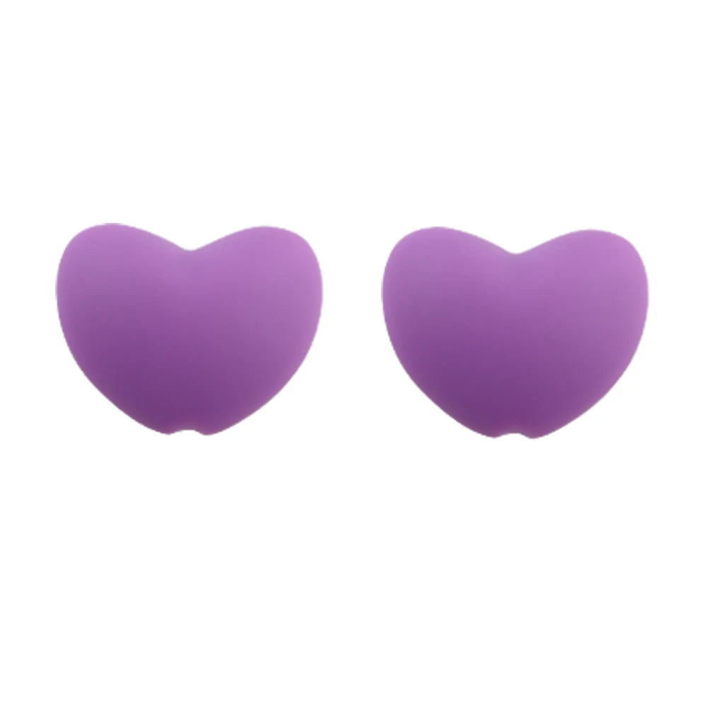 A pair of purple silicone heart beads for DIY jewelry making