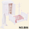 White miniature dollhouse furniture set featuring a cabinet, mirror, and bed with floral bedding.