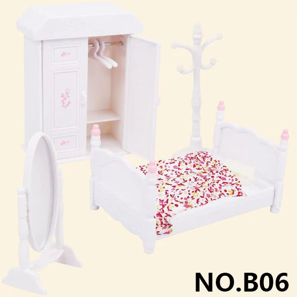 White miniature dollhouse furniture set featuring a cabinet, mirror, and bed with floral bedding.