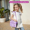 A young girl is carrying a purple insulated lunch bag with a strap while standing outdoors.