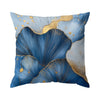 A square cushion cover featuring abstract blue leaf patterns with gold accents.