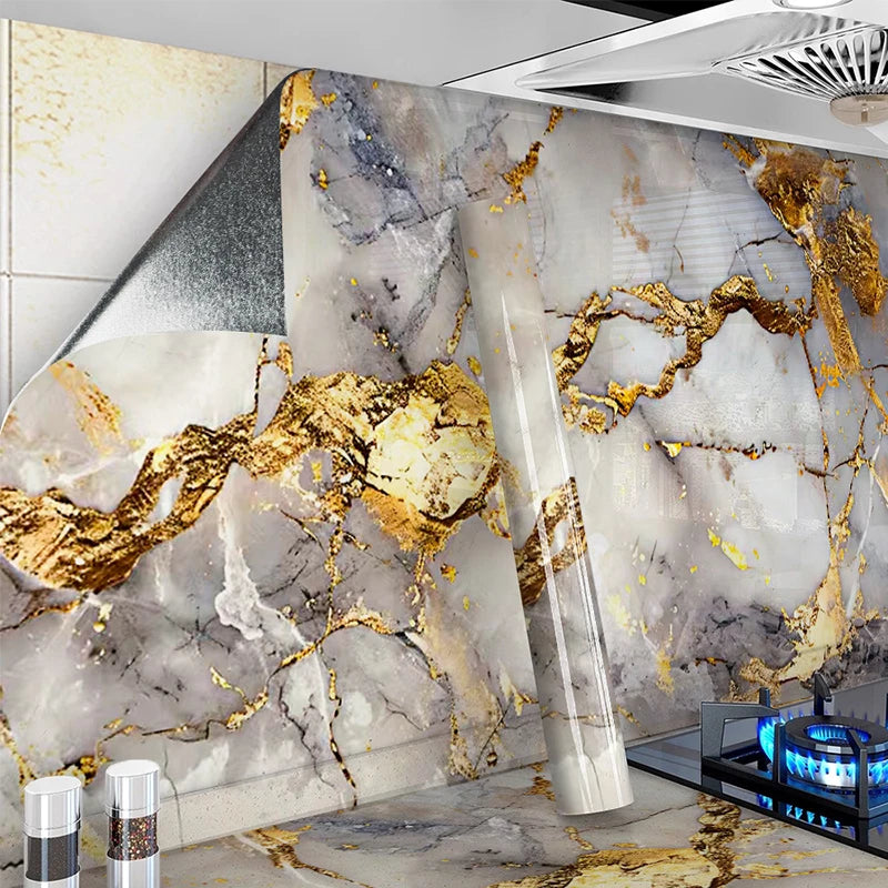 A marble peel-and-stick kitchen backsplash featuring gray and white marble with gold veining.