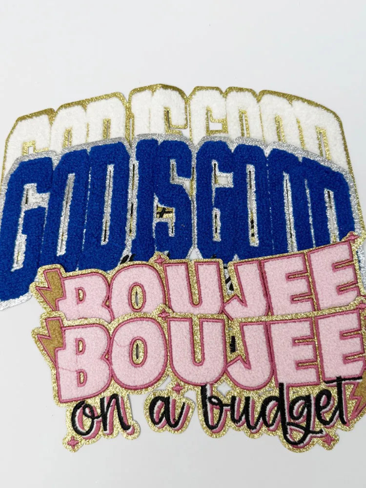 Embroidered patch featuring the text GOD IS GOOD and BOUJEE on a budget in gold and blue thread.
