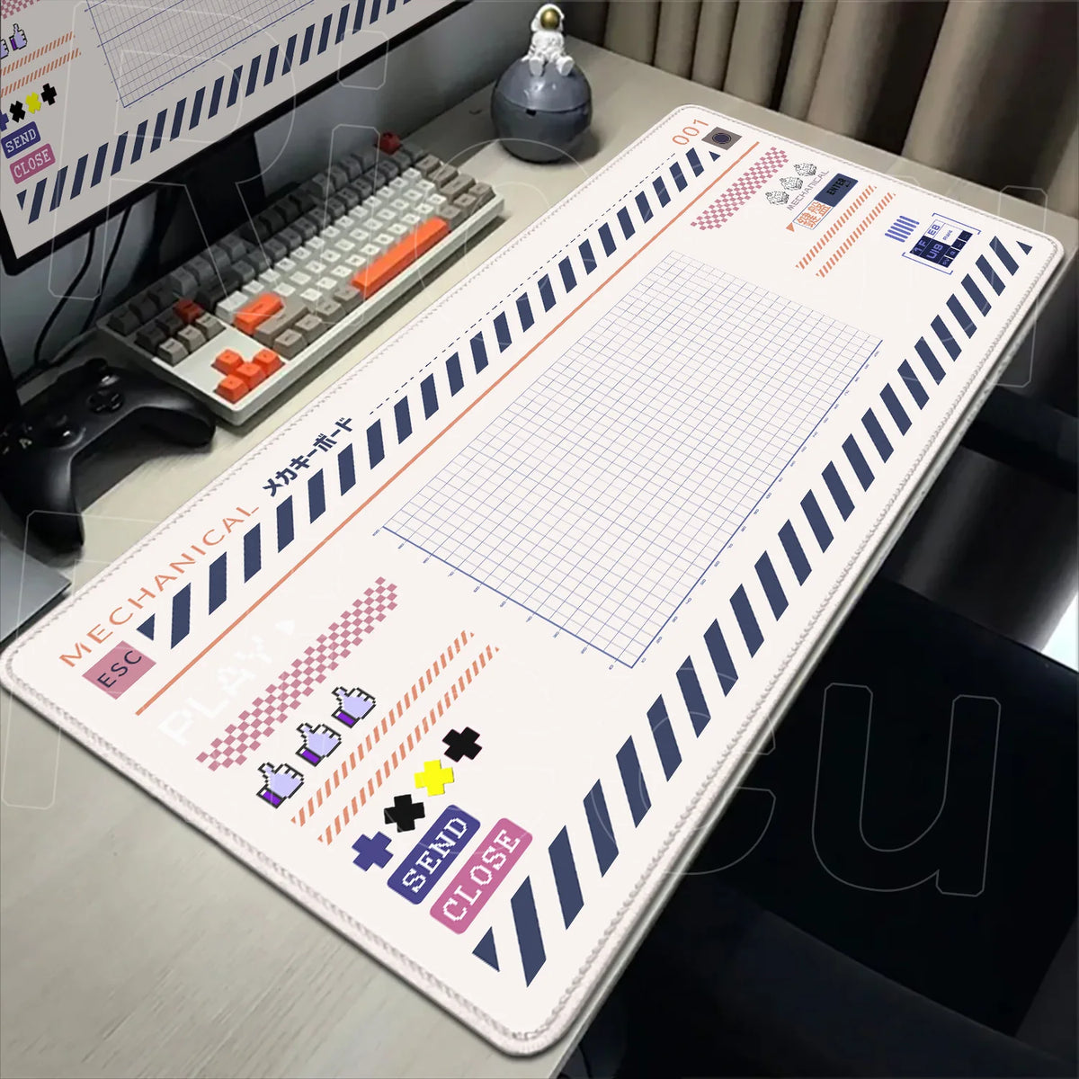 A large Japanese art mouse pad with a grid pattern and various icons is displayed on a desk next to a keyboard.