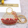 Gold handbag keychain decorated with red and white crystal rhinestones