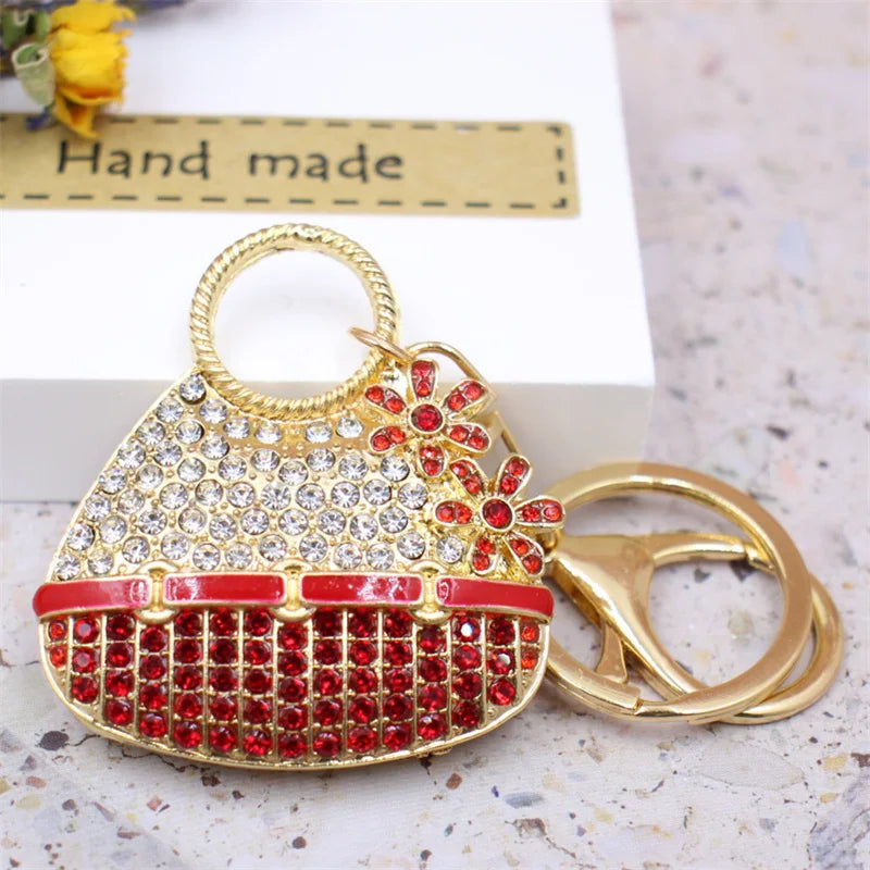 Gold handbag keychain decorated with red and white crystal rhinestones