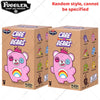 A box of Fuggler Care Bears plush keychains featuring pink bears with rainbow horns and various colors.