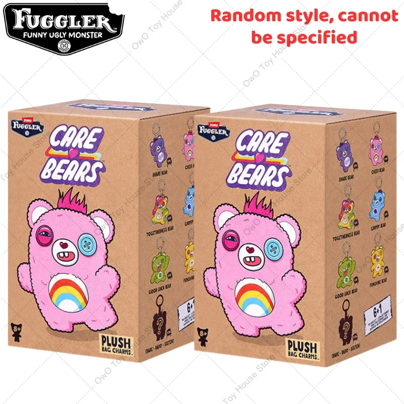 A box of Fuggler Care Bears plush keychains featuring pink bears with rainbow horns and various colors.