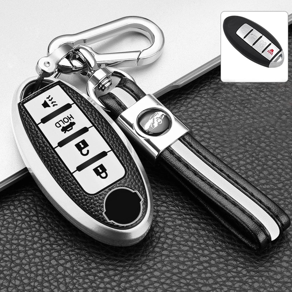 A silver key fob cover with a black leather strap and a small inset showing various functions.