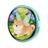 Anime digital badge featuring a cute orange fox resting in a green meadow with purple flowers.