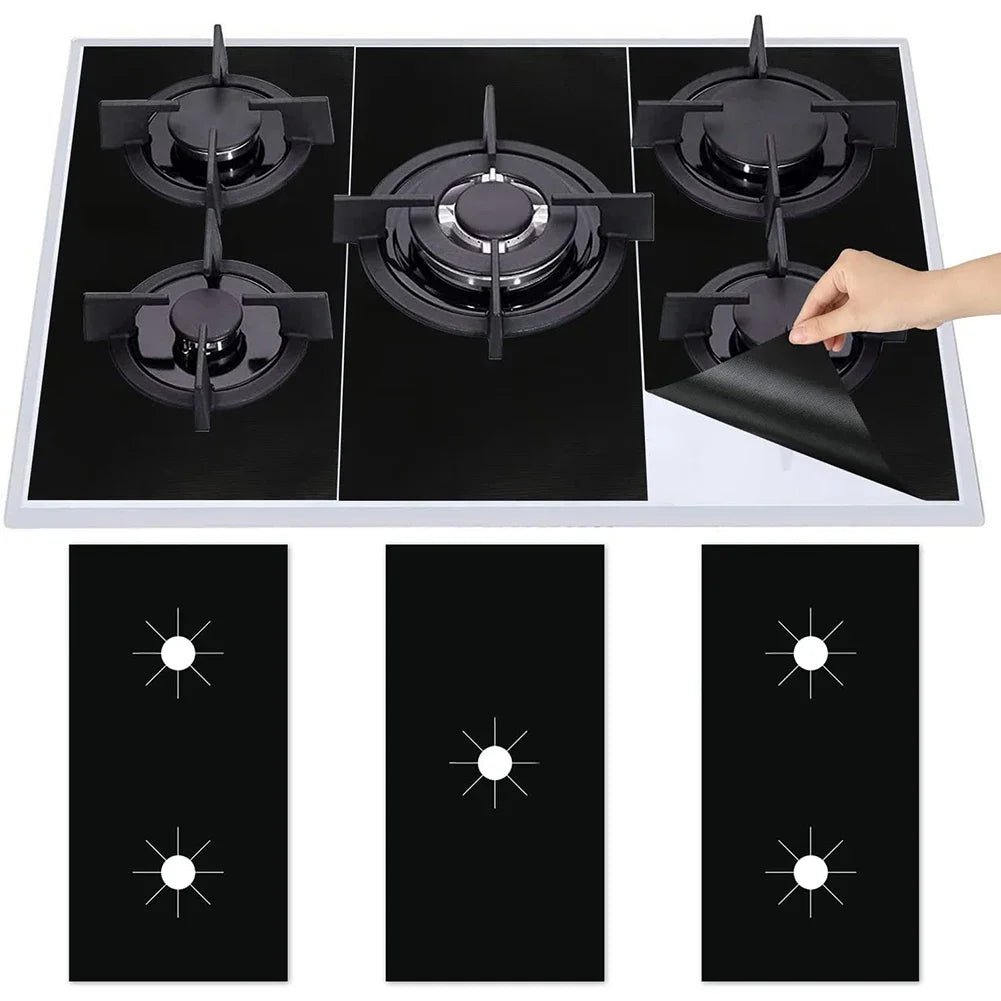 A black gas stove protector pad is shown placed on a stovetop burner.
