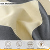 Close-up of 100% microfiber fabric showing soft yellow and dark gray checkered print texture.