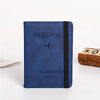 A dark blue passport cover and travel wallet with a black trim and a silver airplane icon.