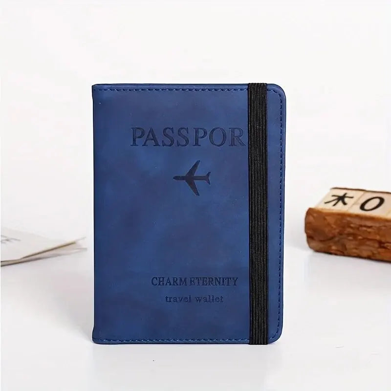 A dark blue passport cover and travel wallet with a black trim and a silver airplane icon.