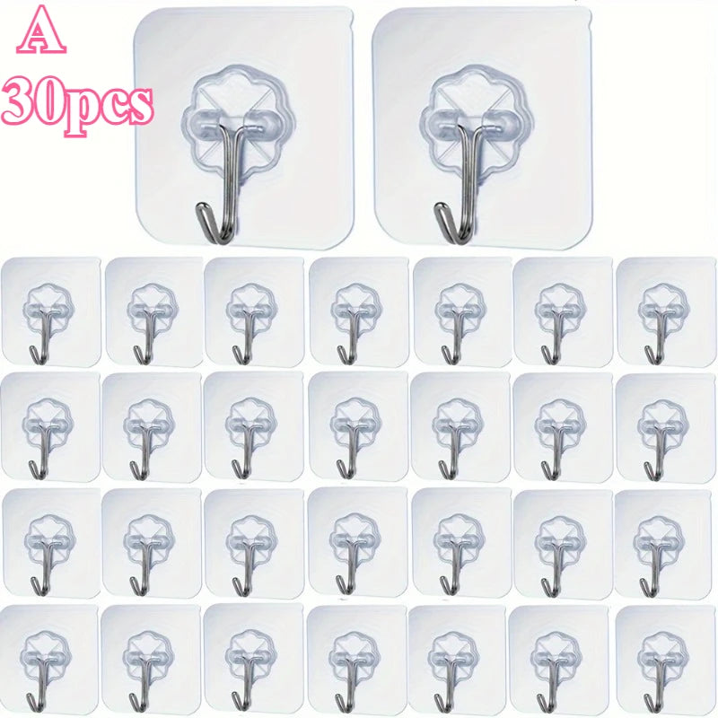 A set of 30 clear heavy-duty self-adhesive wall hooks shown in various orientations and sizes.