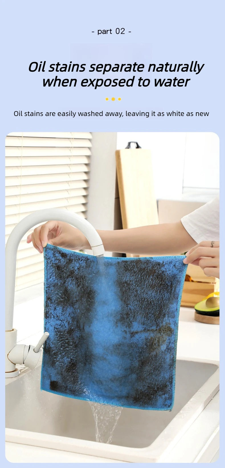 A blue microfiber cleaning cloth is being washed under a faucet in a kitchen sink.