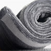 A close-up of a soft velvet anti-skid protector for refrigerator handles, rolled up and textured.