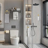 A modern bathroom featuring a toilet, wall-mounted accessories, and a glass shower enclosure.