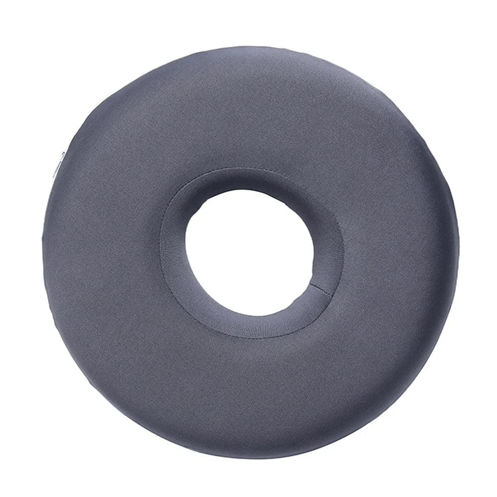 A gray memory foam ear piercing pillow with a cutout for side sleepers.