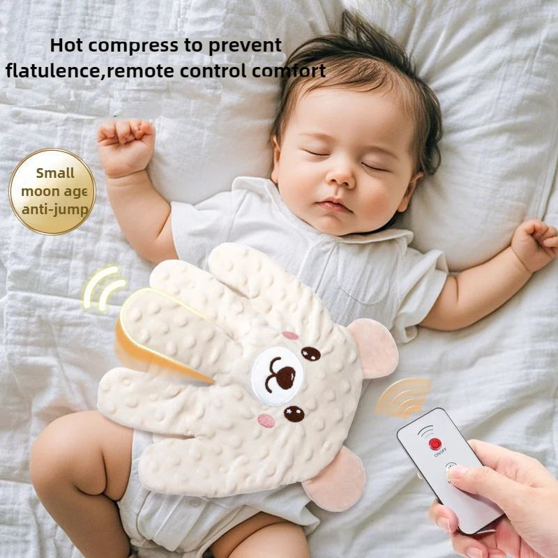 A baby is sleeping on a white sheet with a soft, palm-shaped anti-jump compress for comfort.