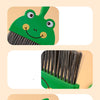 A green cartoon-shaped broom with a head resembling a frog is shown next to its bristles.