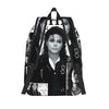 A black backpack shaped like a musical icon, featuring a portrait of a woman.