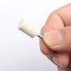 A hand holds a white wool felt polishing wheel with a metal shank for rotary tools.