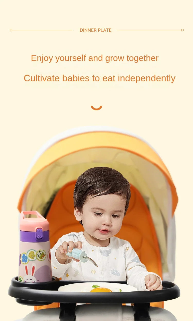 A baby is eating from a plate in a stroller snack tray with a cup holder and phone slot.